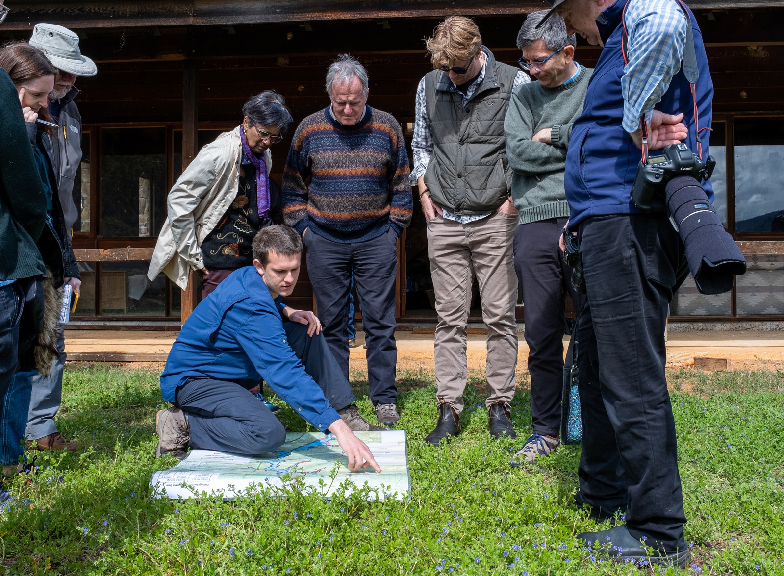 Team collaborating around map